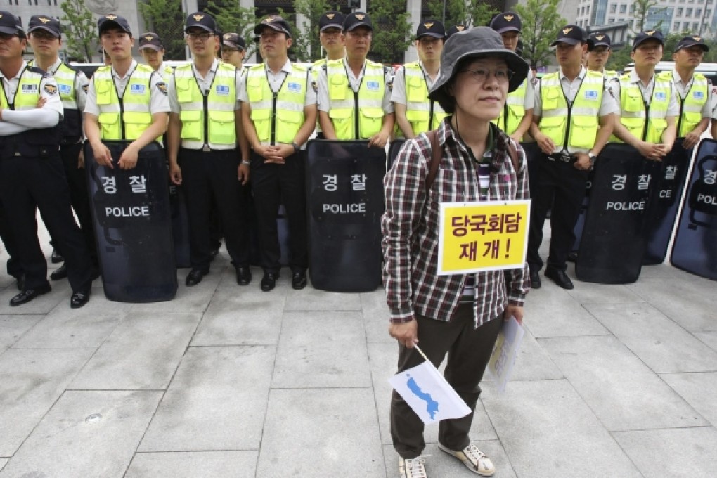 A protester opposing Seoul's policy against North Korea at a rally demanding resumption of high-level talks. Photo: AP