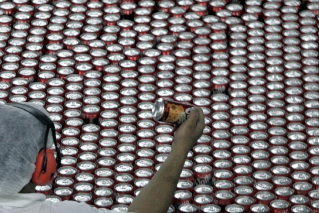 A Brazilian worker on the production line for Mexican drinks maker Del Valle. Strong trading links are building within the region. Photo: AFP