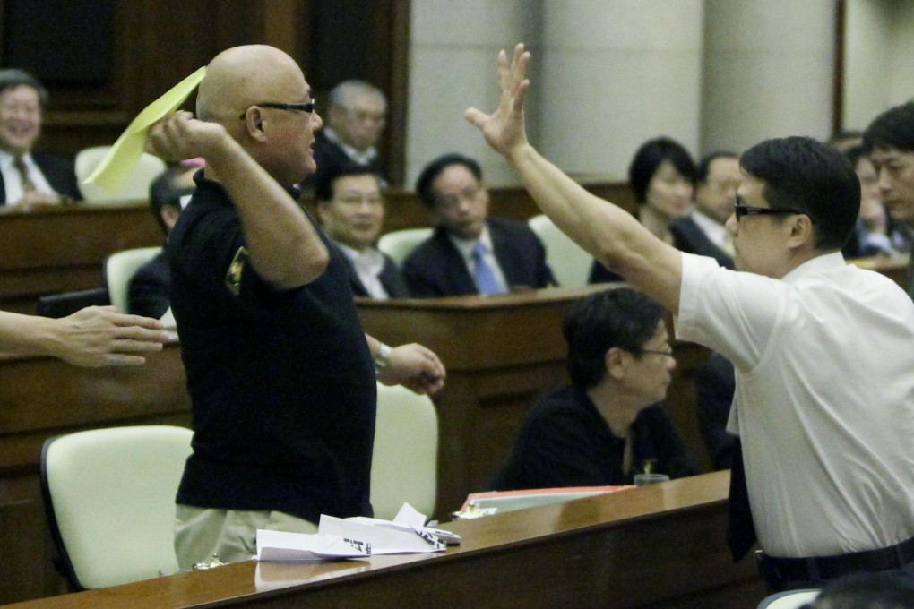 Lawmaker Albert Chan Wai-yip throws a paper plane at the then chief executive Donald Tsang in 2011. Legco members owe the chief executive no loyalty. Photo: Felix Wong