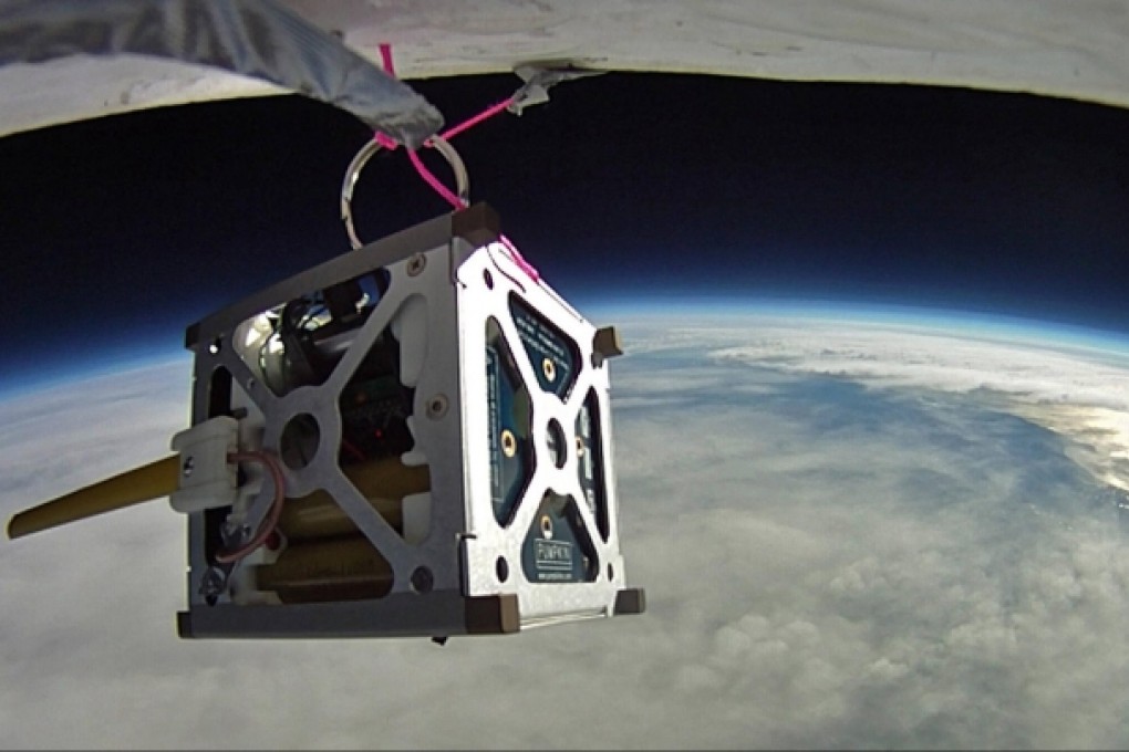 A satellite made up of three smartphones during a high-altitude balloon test earlier this year. Photo: Nasa Ames Research Centre