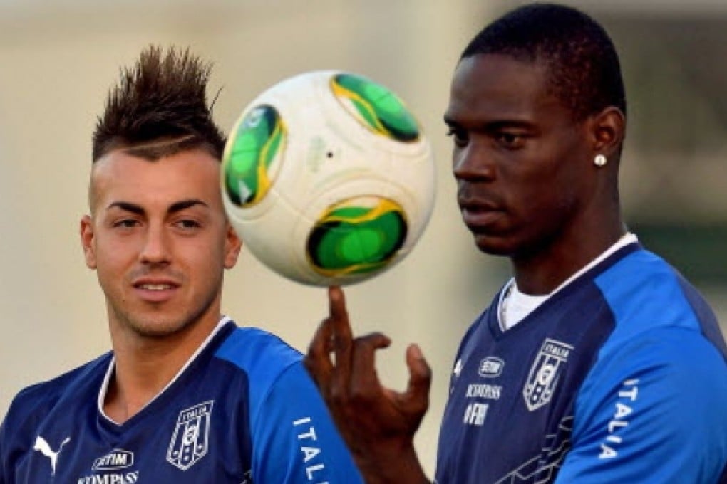 Mario Balotelli (right) balances a ball on his finger beside Stephan El Shaarawy, his Confederations Cup striking partner. Photo: AFP