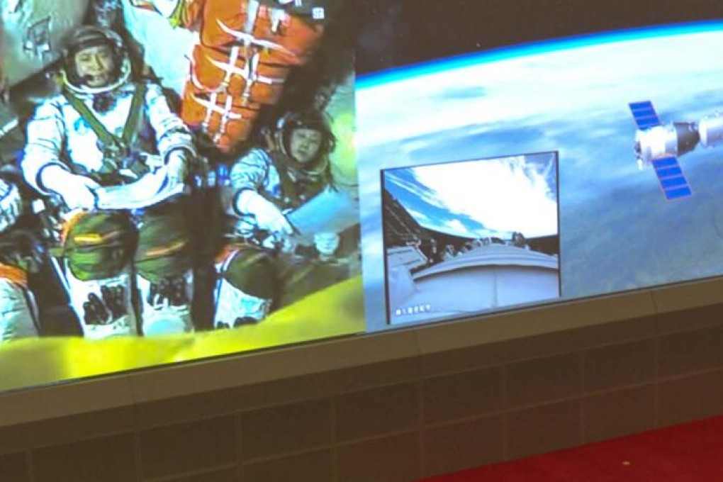 The Shenzhou-10 spacecraft, carrying three astronauts, docks with the Tiangong-1 module. Photo: Xinhua