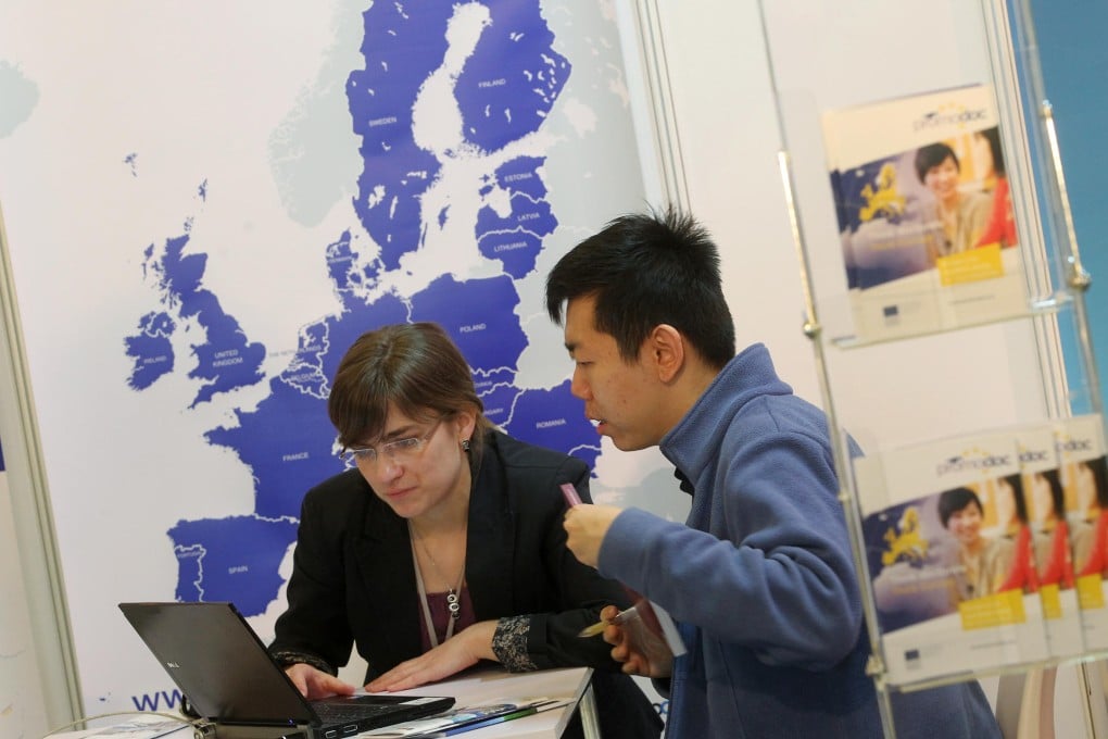 A visitor at the European Higher Education Fair at the Hong Kong Central Library finds out about available options. Photo: KY Cheng