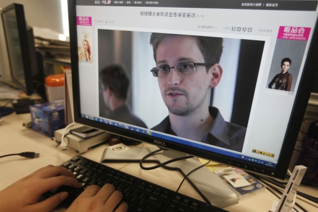 Picture of Edward Snowden, a contractor at the National Security Agency (NSA), is seen on a computer screen displaying a page of a Chinese news website. Photo: Reuters