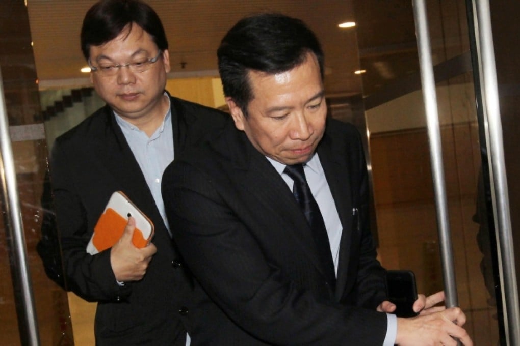 Peter Chan, followed by Pastor Lam Yee-lok, leaves court yesterday. Lee christened Chan in March. Photo: Edward Wong