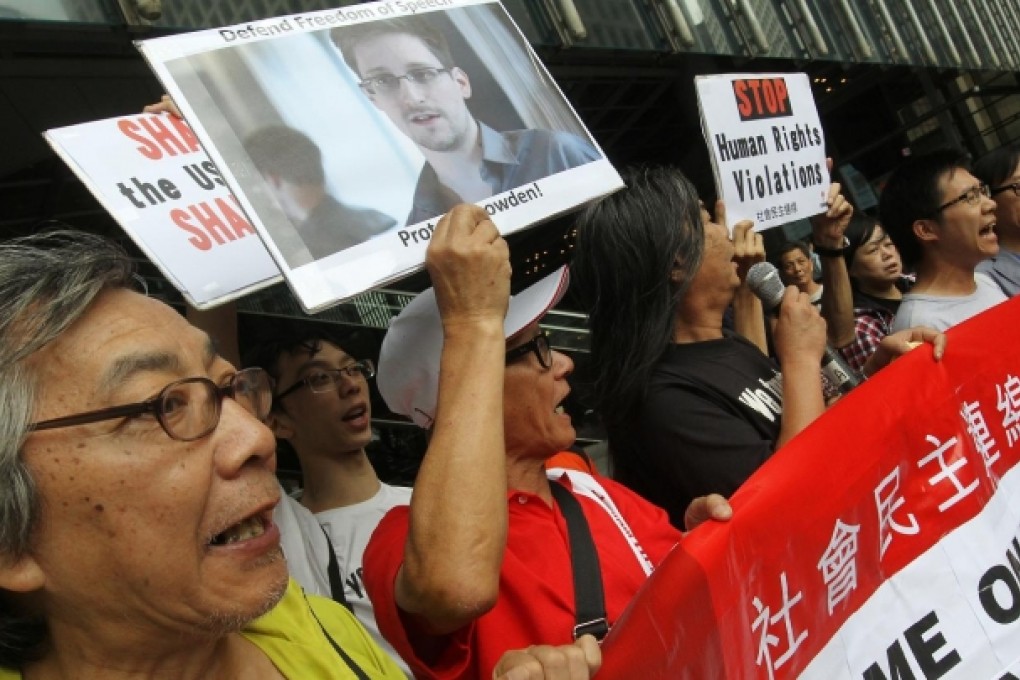 Members of League of Social Democrats gather at HSBC headquarters and march to the US consulate to support Edward Snowden. Photo: SCMP/Edward Wong