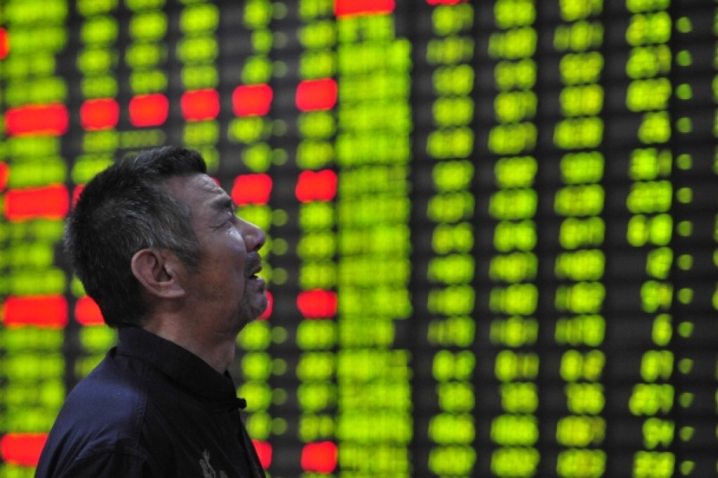 An investor is seen at a trading hall of a securities firm in Jiujiang, east China's Jiangxi Province. Photo: Xinhua