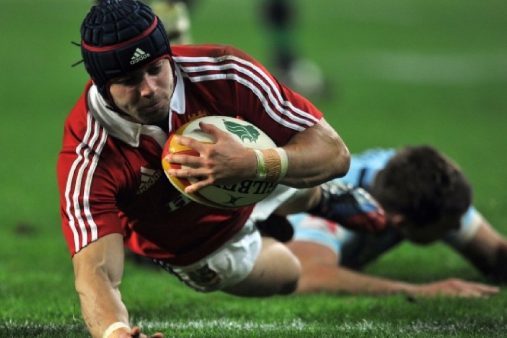 Fullback Leigh Halfpenny scores one of his two tries against the NSW Waratahs on Saturday. Photo: EPA