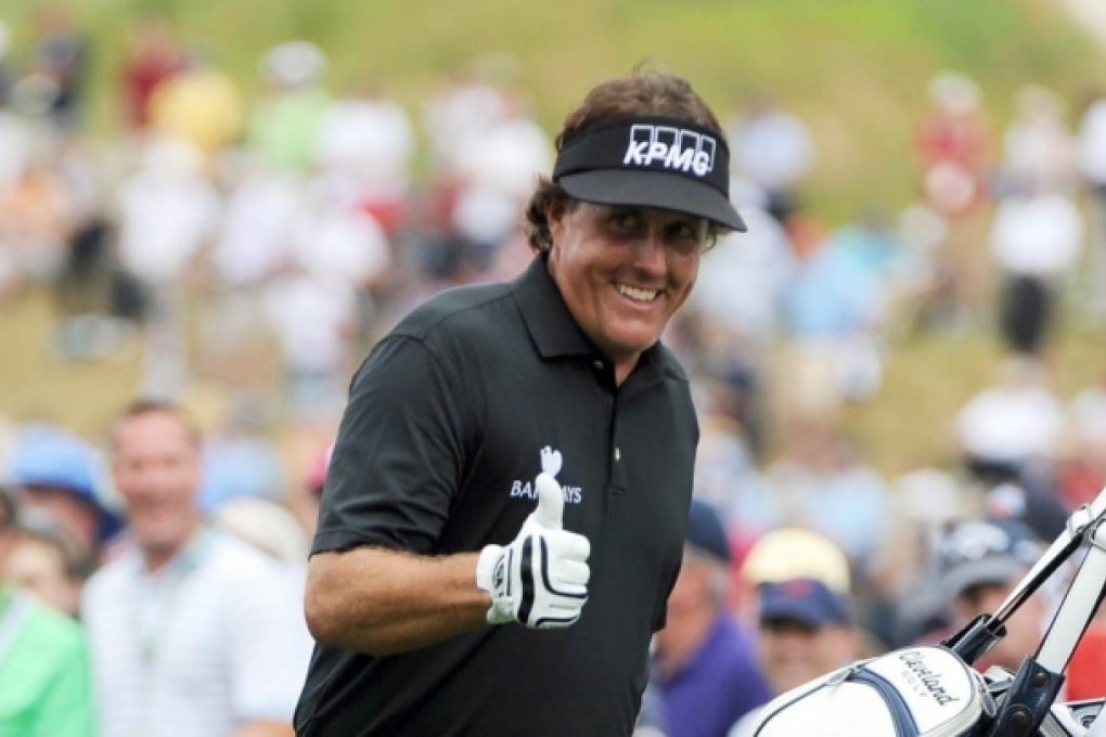 Mickelson smiles after sinking a putt at Merion. Photo: MCT