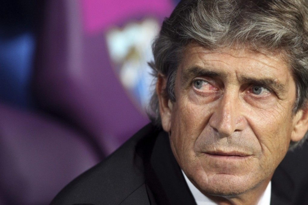Chilean Manuel Pellegrini, 59, takes the helm at Manchester City with his first goal - snatching the league title from United. Photo: EPA