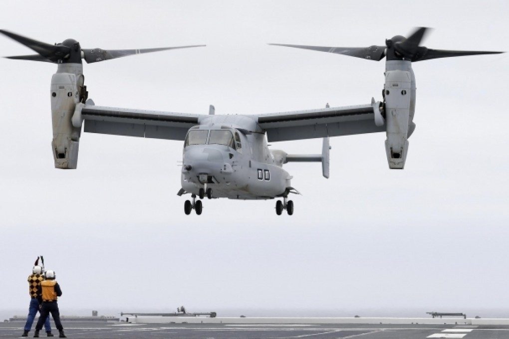 A US Osprey lands on the Japanese destroyer Hyuga. Photo: AP