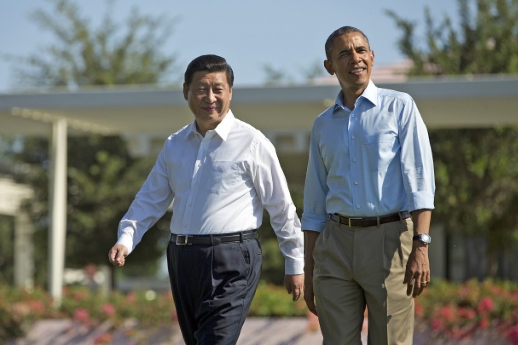 President Barack Obama and Chinese President Xi Jinping walk at the Annenberg Retreat of the Sunnylands estate. Photo: AP