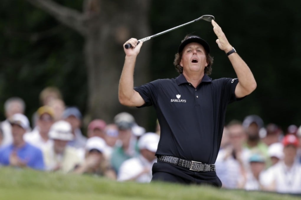 Phil Mickelson reacts to his shot from the bunker during the fourth round of the US Open at Merion in Pennsylvania. Mickelson finished runner-up at the tournament for the sixth time. Photo: AP