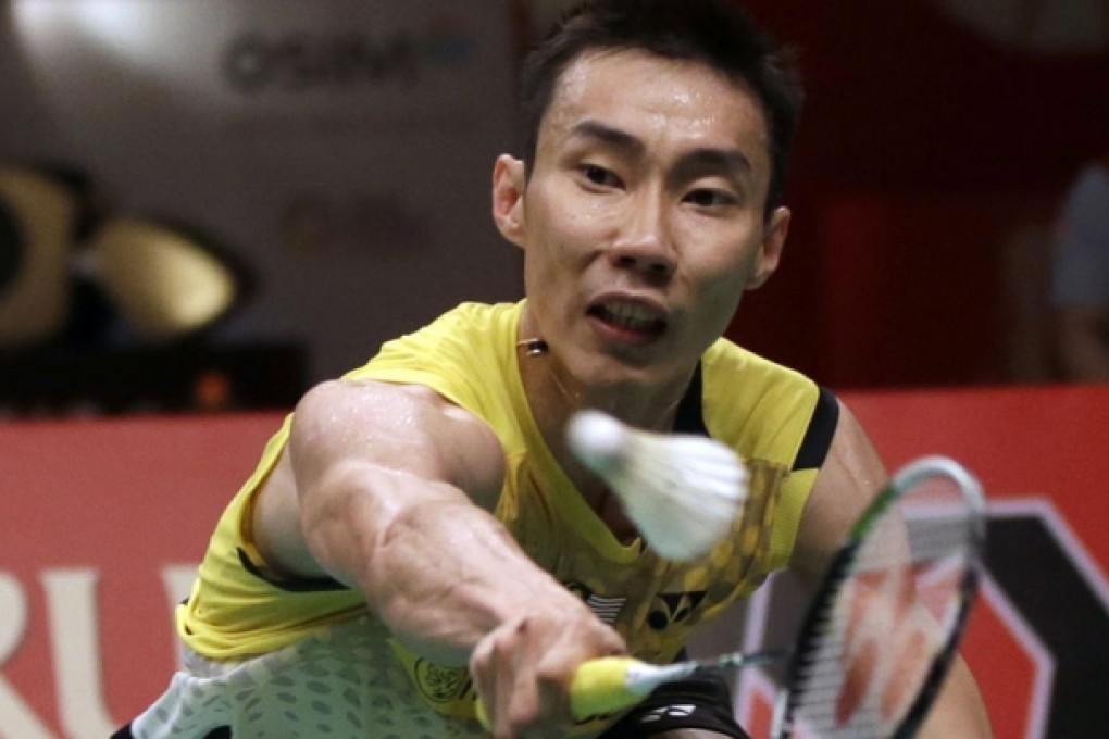 Lee Chong Wei hits a return to Marc Zwiebler during the Indonesia Open final in Jakarta. Photo: AP