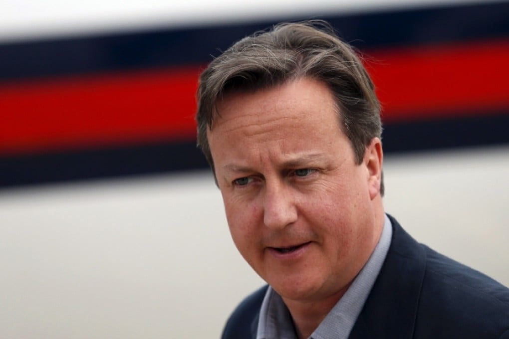 Britain's Prime Minister David Cameron arrives at Belfast International Airport, Northern Ireland. Photo: AFP