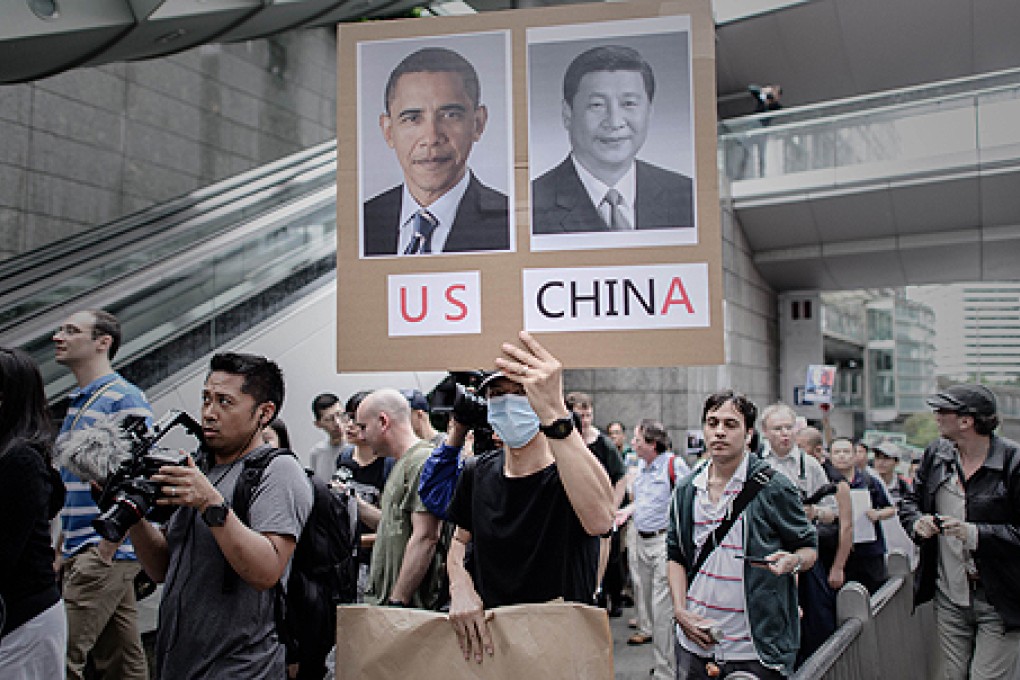 Protesters in Hong Kong march to the US consulate in support of Edward Snowden. Photo: AFP