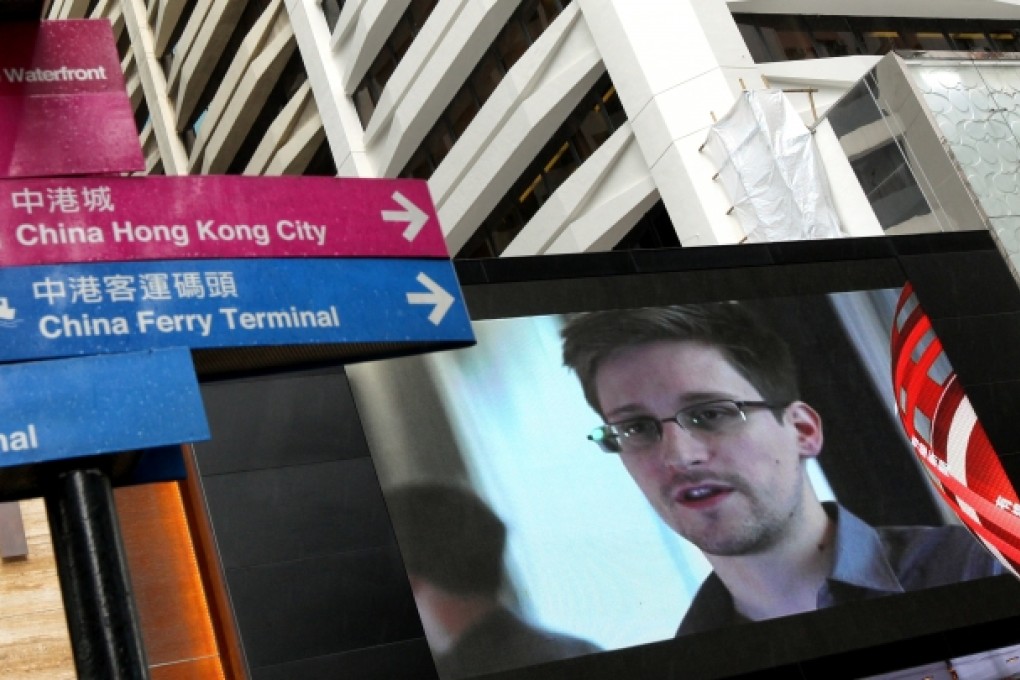 Television screens in Tsim Sha Tsui shows the footage of US surveillance whistleblower Edward Snowden on June 17, 2013. Photo: SCMP