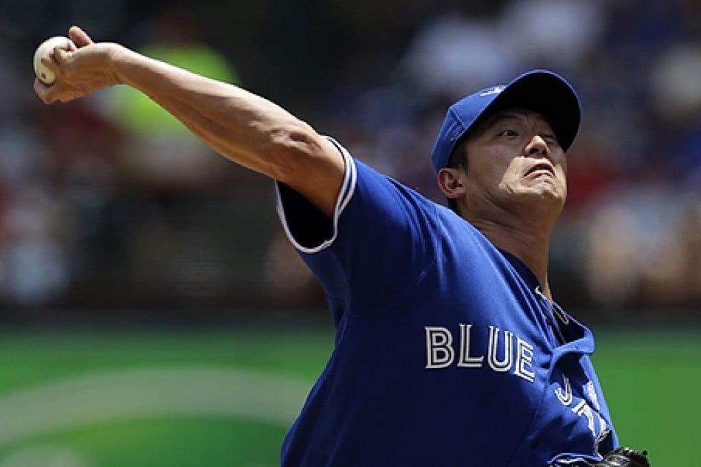 Toronto Blue Jays starting pitcher Wang Chien-ming delivers to the Texas Rangers in the first inning on Sunday. Photo: AP