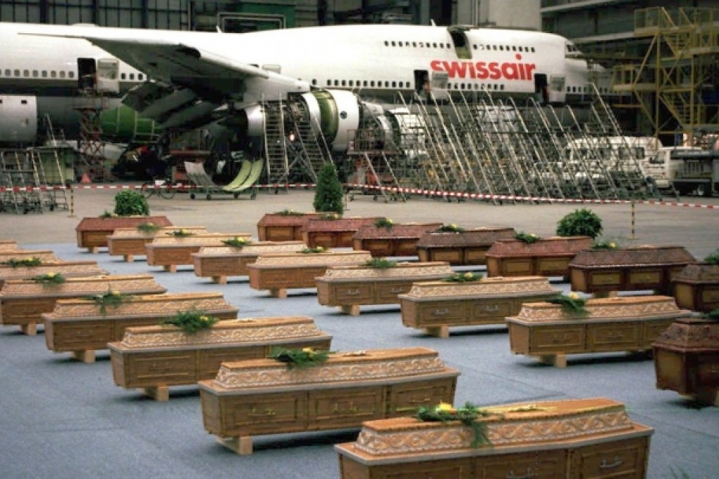 The coffins of the 36 victims of the massacre in Luxor stand in a hall in the Zurich airport. Photo: AFP