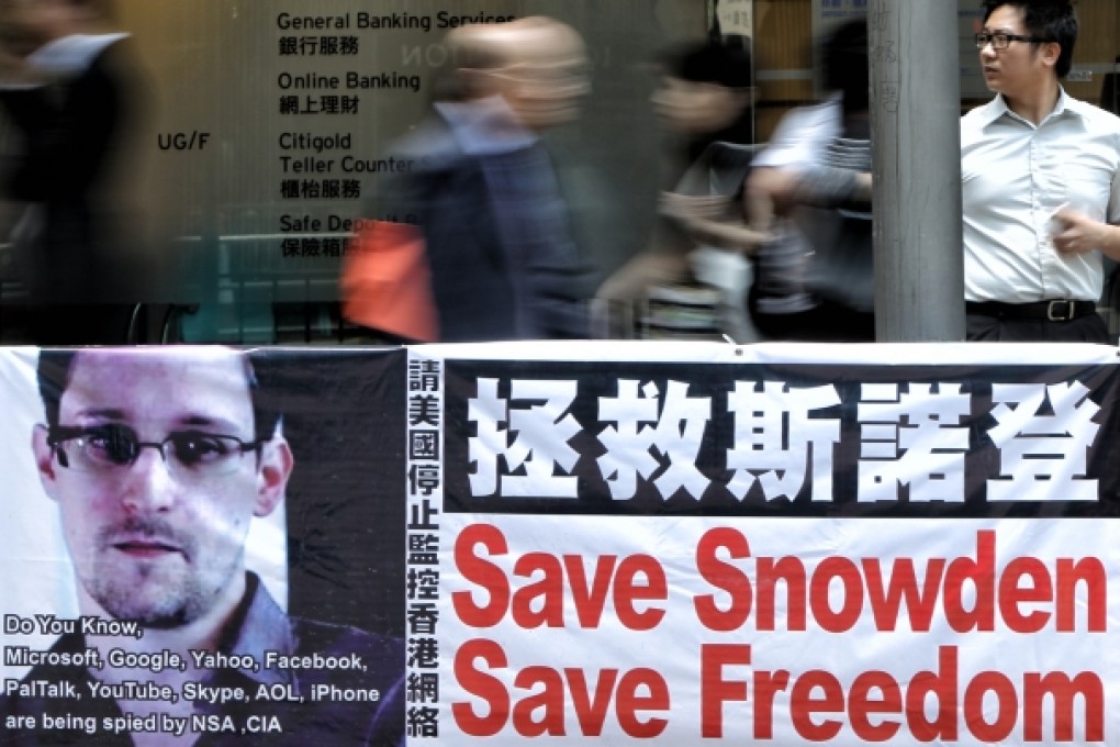 A banner supporting Edward Snowden, a former contractor at the National Security Agency (NSA), is seen at Central district. Photo: David Wong
