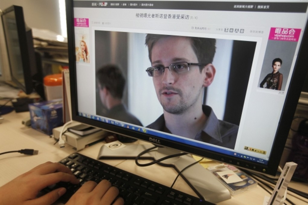 A picture of Edward Snowden, a contractor at the National Security Agency (NSA), is seen on a computer screen displaying a page of a Chinese news website. Photo: Reuters