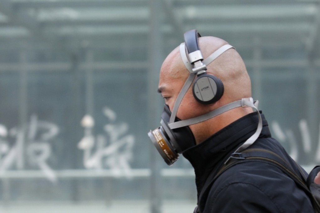 A man wearing a mask is seen on a street in Beijing. Photo: Reuters