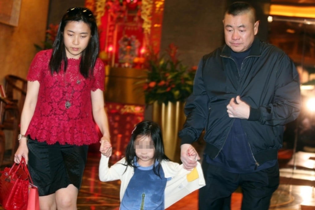 Joseph Lau leaves the Fook Lam Moon restaurant in Wan Chai yesterday with Chan Hoi-wan and daughter Josephine. Photo: Sam Tsang