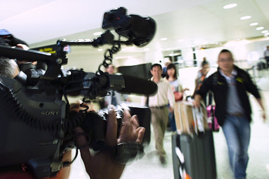 Travellers from United Airlines Flight 116 arrives in Newark, New Jersey. Photo: Reuters