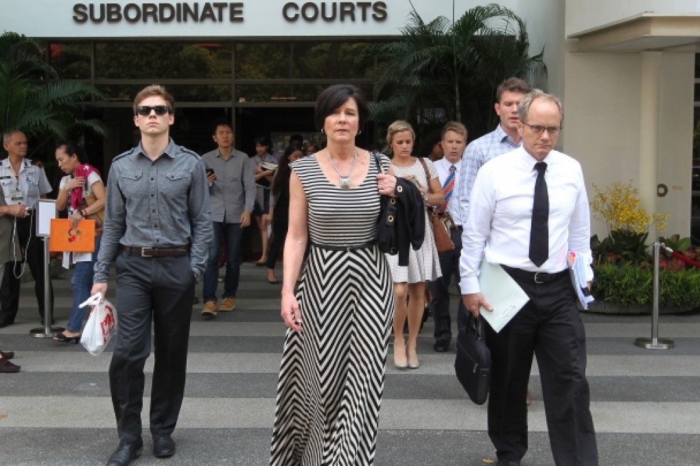The parents of Shane Todd, Mary, front left, and Rick Todd, right, leave the Subordinate Courts of Singapore. Photo: AP