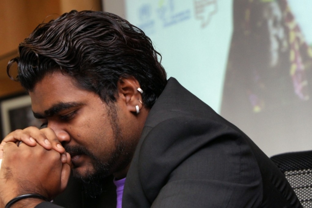 Siva, a refugee, shares his experiences in Hong Kong at a press conference ahead of World Refugee Day by UNHCR and other NGOs at Central. Photo: David Wong