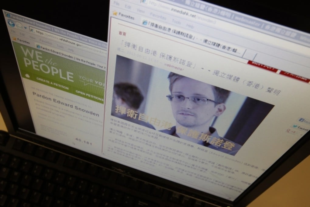 Statement by Hong Kong online media platform supporting Snowden displayed alongside White House website on computer screen in Hong Kong. Photo: Reuters