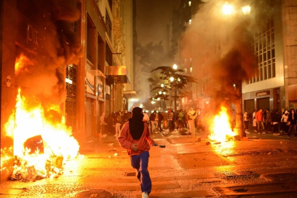 Brazilian demonstrators take part in a protest against price increase of public transport and government spending for the FIFA Confederations Cup Brazil 2013 and World Cup Brazil 2014, in Sao Paulo. Photo: Xinhua