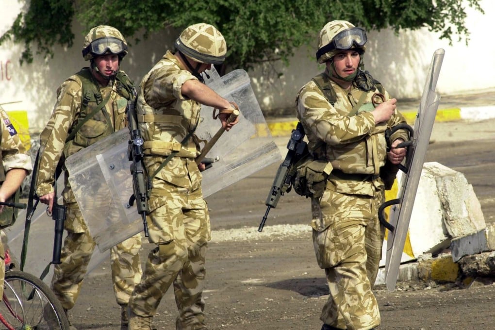 British troops in action in Iraq in 2004. Britain’s highest court says the families of several soldiers killed or injured in Iraq can sue the government for failing to protect them. Photo: AP