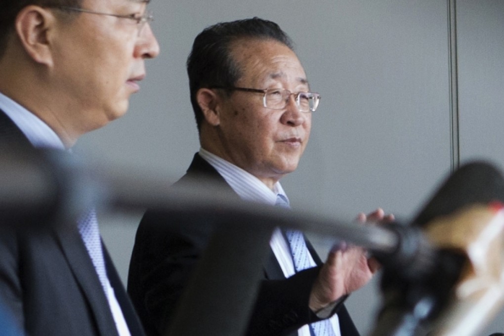 North Korea's First Vice Foreign Minister Kim Kye-gwan, right, waves as he arrives at the Capital airport in Beijing. Photo: AP