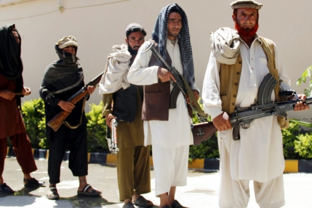 Former Taliban militants attend an amnesty programme in Jalalabad, Afghanistan. The Taliban claimed responsibility on Wednesday for an attack in Afghanistan which killed four American troops. Photo: EPA