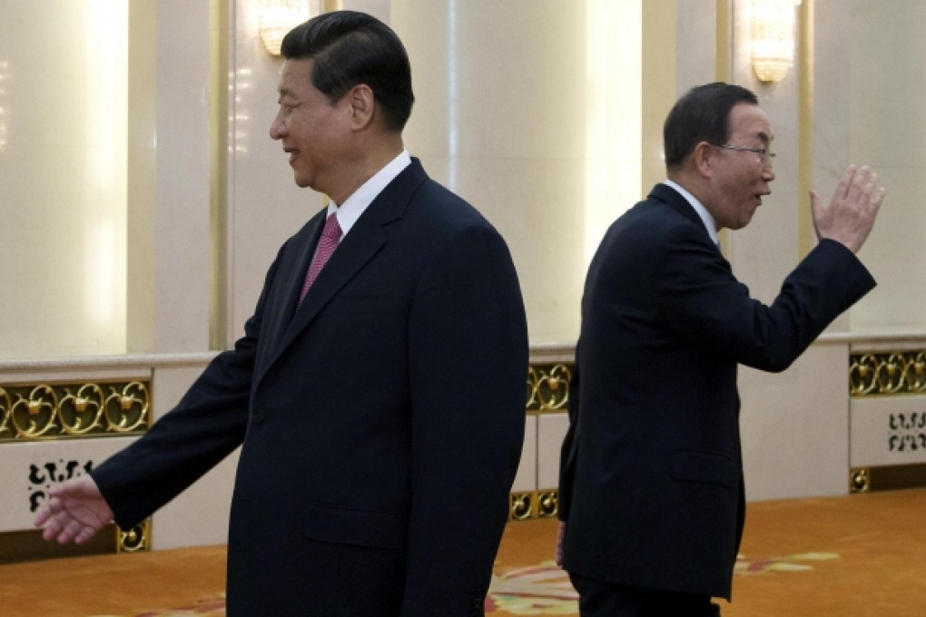 President Xi Jinping greets UN delegates in Beijing while UN Secretary General Ban Ki-moon (right) waves to Chinese officials. Photo: AP
