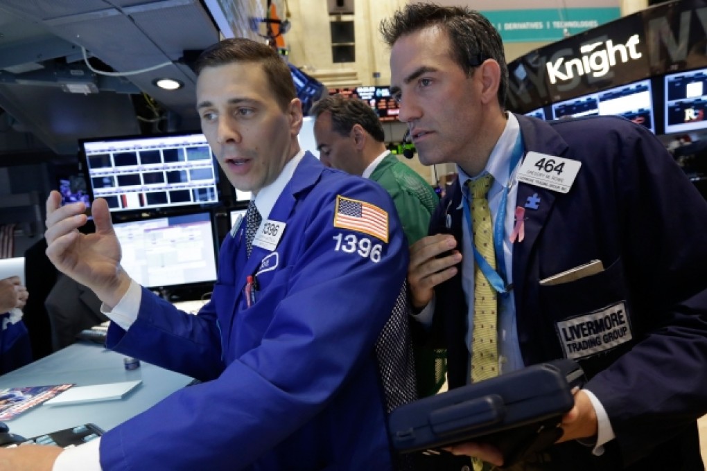 Stocks edged lower in early trading on Wall Street Wednesday as investors waited for word from the Federal Reserve. Photo: AP