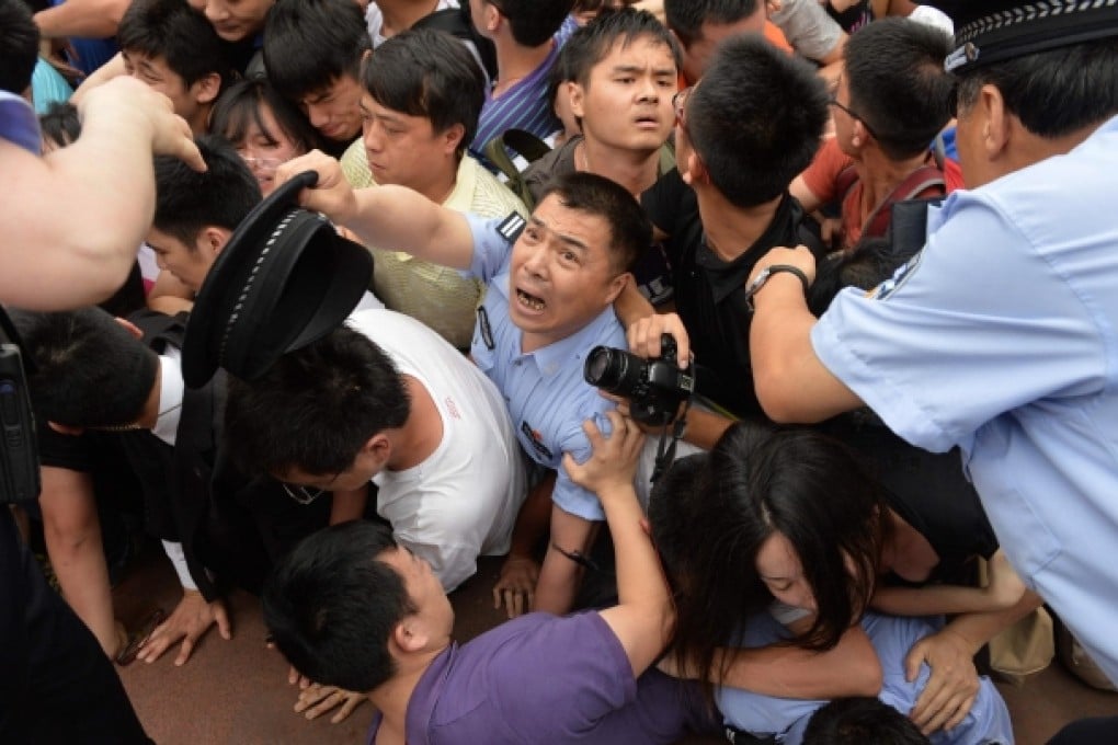 Panic breaks out at Tongji University during the stampede to see David Beckham, overwhelming police and security guards. Photo: AFP