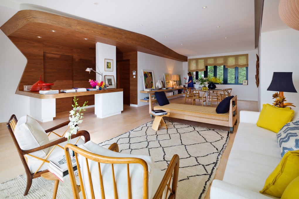 Living area: Davidclovers (1/F, 123 Queen’s Road East, Wan Chai, tel: 6259 0433), the architects who undertook the restoration of the building and renovation of the four apartments within it, designed the open bar area leading to the entrance, using wooden surfaces that “leak” into the shared stairwell to connect public and private areas. The irregular-patterned rug, bought years ago in Marrakesh, Morocco, anchors a living area featuring a pair of slatted-back 1960s armchairs from London’s Gallery 25 (www.gallery25.co.uk), and a 40s day bed, which was picked up at a flea market in L’Isle-sur-la-Sorgue, Provence, France. Both were moved from Eve Mercier’s previous home, in London, to Hong Kong. The Sori Yanagi Butterfly Stool is available in maple (HK$6,999) and Palisander wood (HK$7,999) from Aluminium (various locations; www.aluminium-furniture.com). Photography: John Butlin