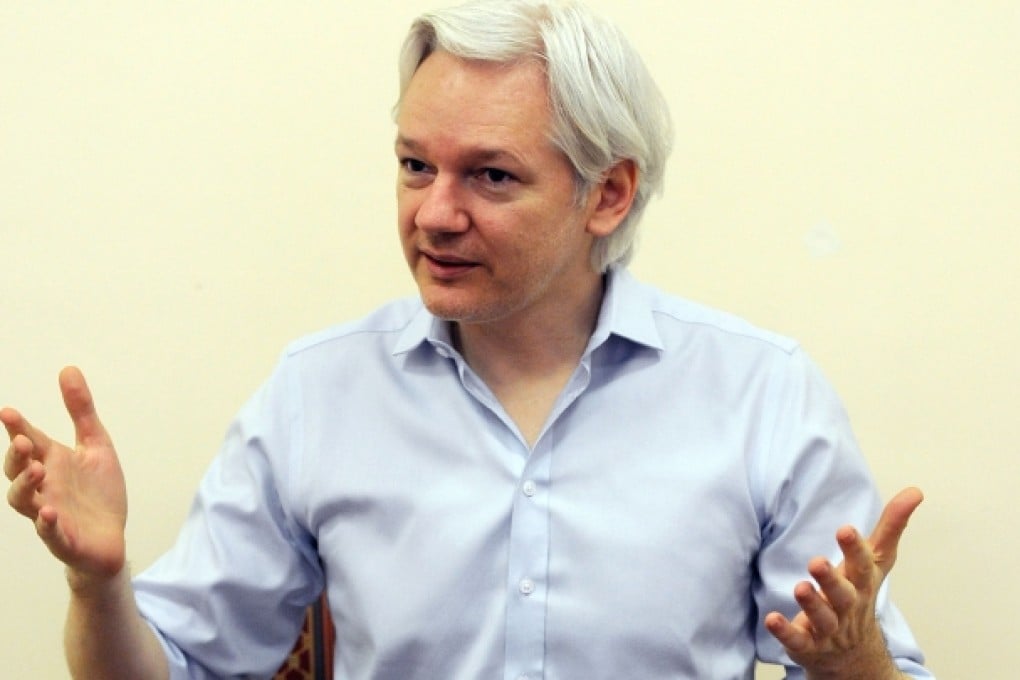 Wikileaks founder Julian Assange speaks to the media inside the Ecuadorian Embassy in London on June 14, 2013. Photo: AFP