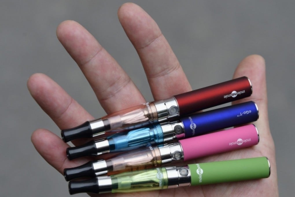 A vendor displays electronic cigarettes. Photo: Reuters