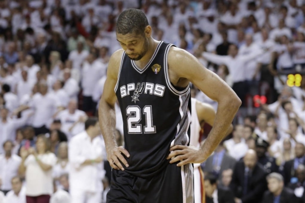 A disappointed Spurs forward Tim Duncan walks off the court after game seven, which saw Miami Heat defeat San Antonio. Photo: AP