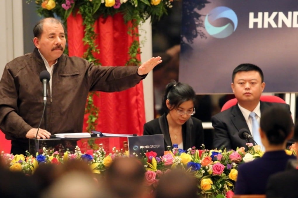 Nicaraguan President Daniel Ortega (left) speaks, while Wang Jing (right), boss of HKND Group looks on. HKND has won a concession to design, build and manage a US$40 billion canal in Nicaragua to rival Panama. Photo: AFP