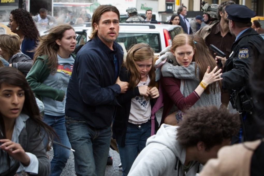 This image released by Paramount Pictures shows, from center left, Brad Pitt as Gerry Lane, Abigail Hargrove as Rachel Lane, and Mireille Enos as Karin Lanein a scene from "World War Z." Photo: AP