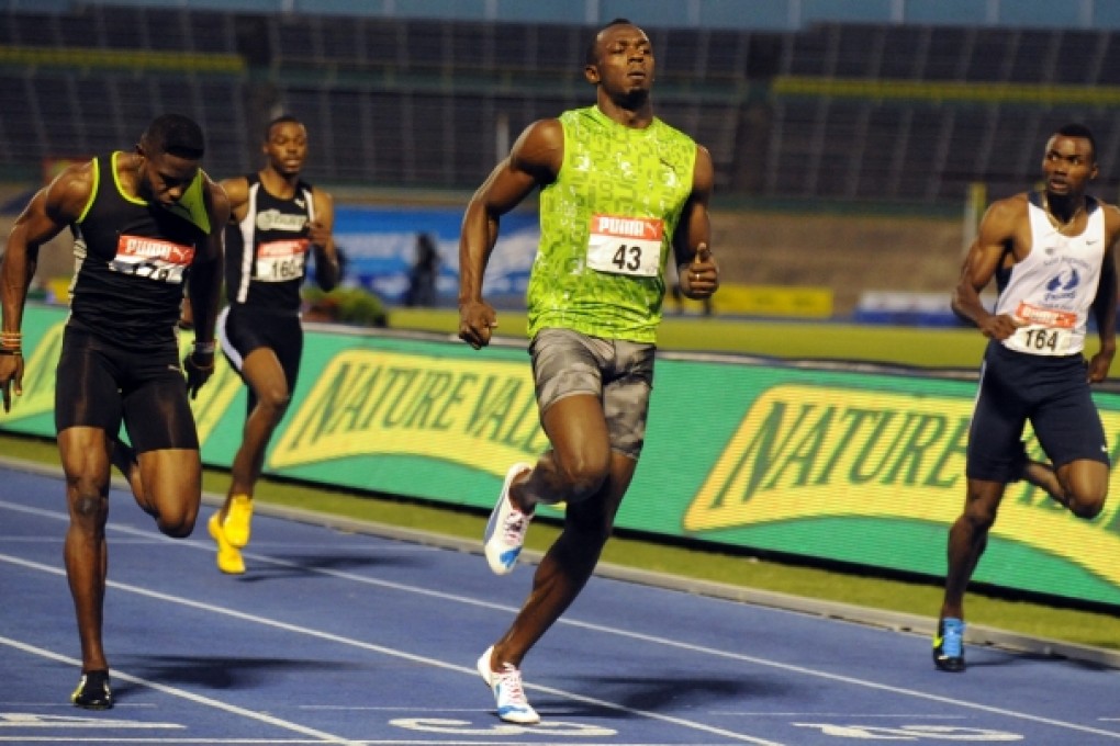 Jamaica's Usain Bolt  wins the qualification heat in the men's 100m dash of the Jamaica Senior National Trials in Kingston. Photo: AP