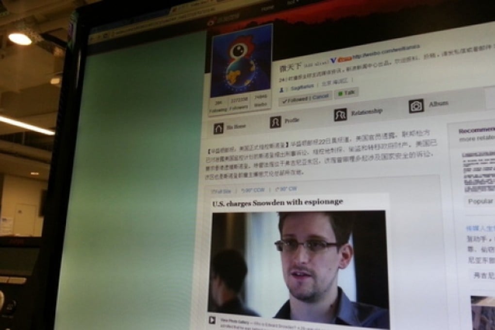 A monitor showing the latest Edward Snowden, translated in Chinese for Sina Weibo. Photo: SCMP Pictures