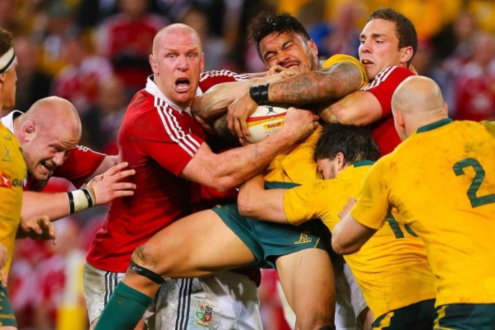 Lions players Paul O'Connell (left) and George North tackle Australia's Digby Ioane during the first test at Suncorp Stadium in Brisbane that the visitors won in front of a 52,500-strong crowd. Photo: AFP