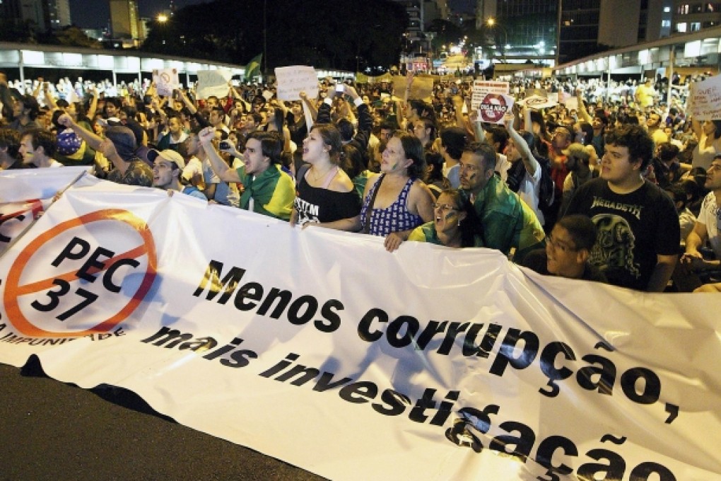Demonstrators in Sao Paulo, Brazil, on Saturday shout slogans against price increases and corruption. Photo: AFP
