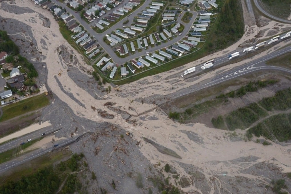 Flooding forces the closure of the Trans-Canada Highway in Canmore, Alberta, about 80 kilometres west of Calgary. Photo: AP