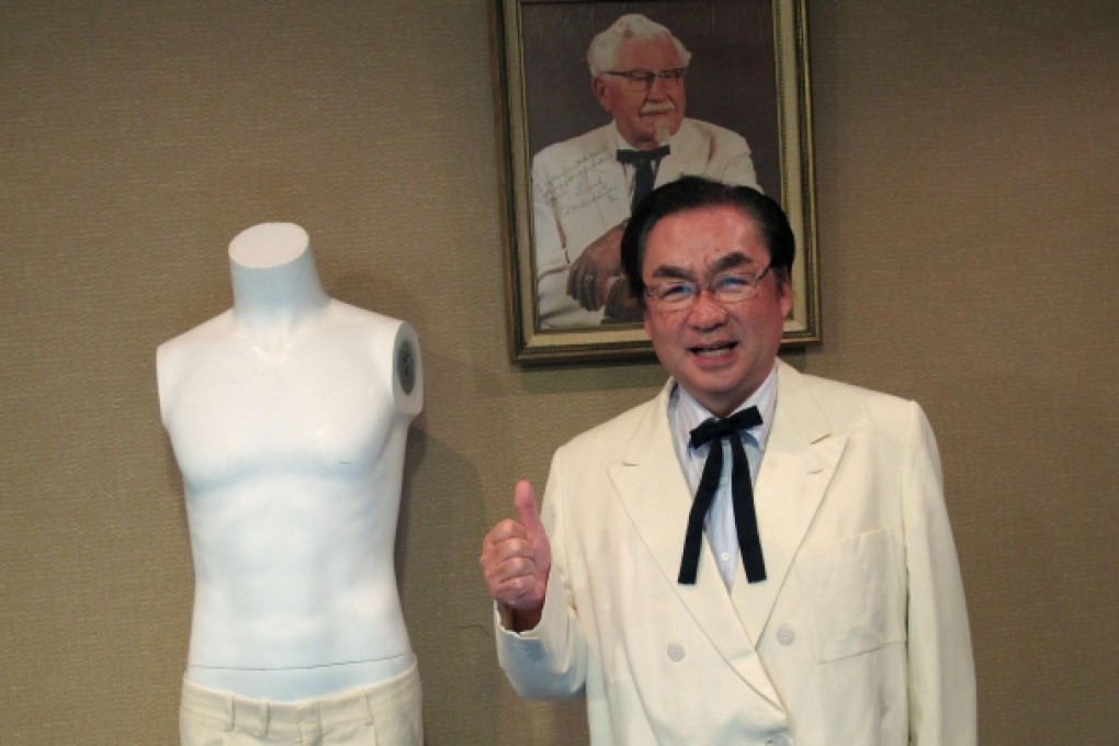 Masao Watanabe wears the "colonel's" suit. Photo: AP